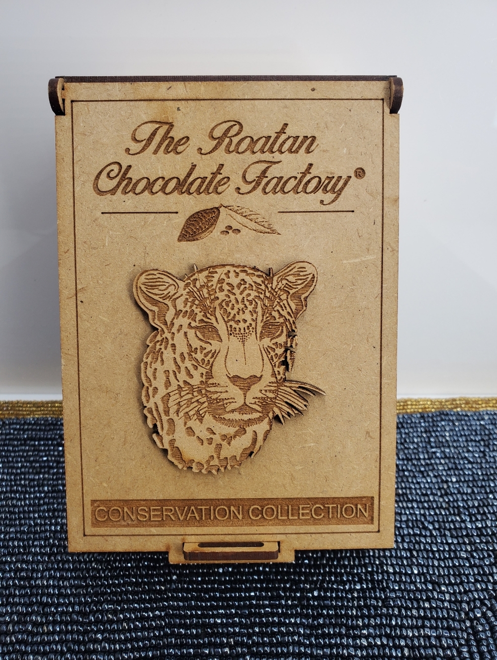 Wooden souvenir box from The Roatan Chocolate Factory wood carving of a jaguar.